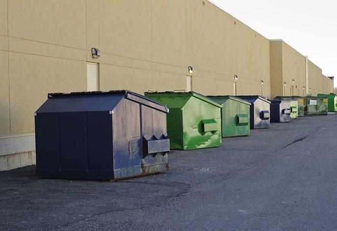 red and green waste bins at a building project in Monticello MS